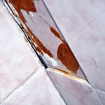 Asbestos walls can be behind tiles and on tile backing. AAG-HAZ-08