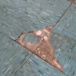 A damaged example of a vinyl floor tile commonly found in homes. General wear and tear over time results in the lifting of tiles and creates a health hazard if they are not removed or replaced. Photo courtesy of www.townsvilleasbestos.com.au AAG-HAZ-10