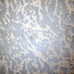 Tilux walling can be found in bathrooms and laundries. Tilux sheeting was used in place of ceramic tiles in bathrooms. It is an extremely hard, waterproof material usually with a pattern design. The colour of the design is most commonly: brown, olive, pink, yellow or blue; other colours can be found. AAG-Prod-Loc05