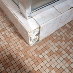 Asbestos can be present behind floor tiles. AAG-Prod-Loc07