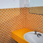 Asbestos can be present behind wall tiles - the tiled wall or the tiles themselves. AAG-Prod-Loc26