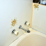 Tilux walling can be found in bathrooms and laundries. Tilux sheeting was used in place of ceramic tiles in bathrooms. It is an extremely hard, waterproof material and is usually patterned. The colour of the design is most commonly: brown, olive, pink, yellow or blue; other colours can be found AAG-Prod-Loc37