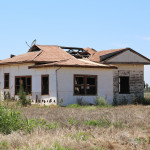 Abandoned fibro house with broken fibro