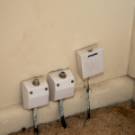 Hazard - Foxtel and tv aerial outlets attached to ACM wall.